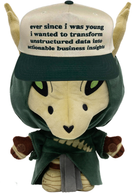 A plush figure wearing a cap that reads "ever since i was young i wanted to transform unstructured data into actionable business insights".